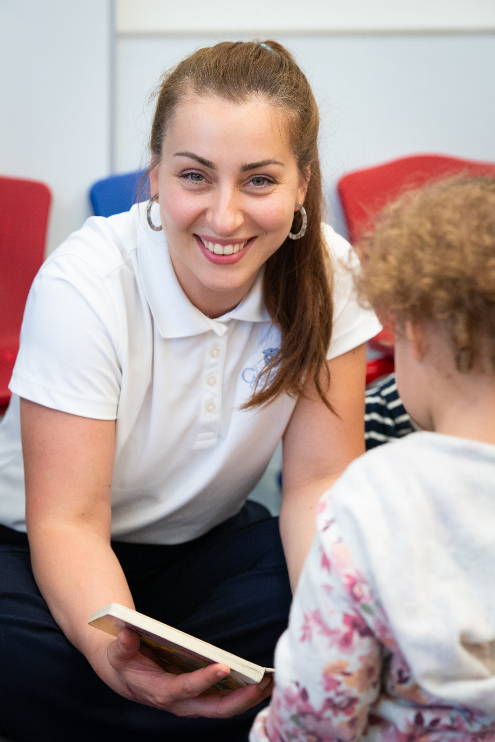 Clearwater Academy teacher working with a young student