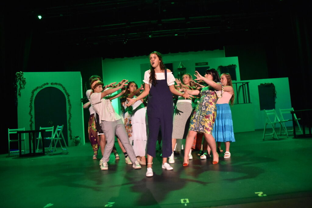 Clearwater Academy students performing together on stage
